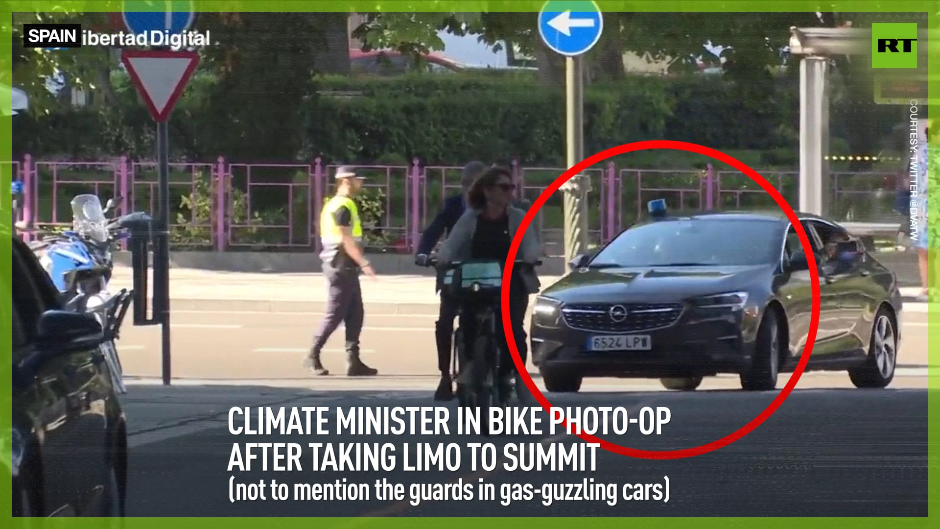 Climate minister in bike photo-op after taking limo to summit