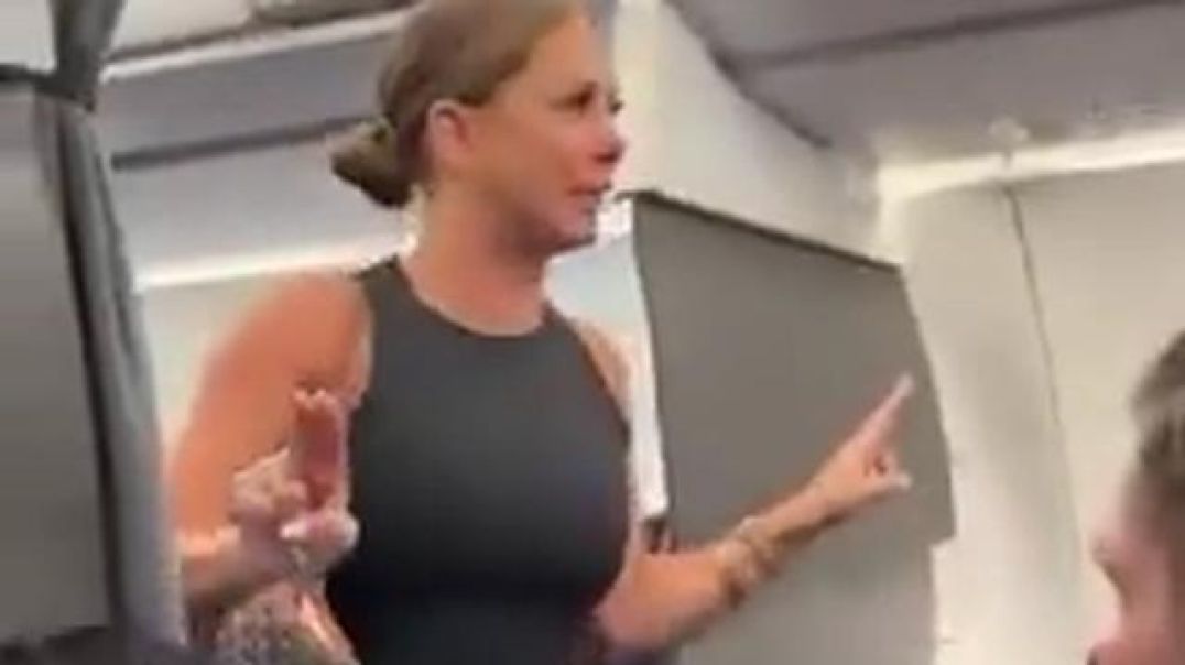 Lady wants off the plane because "that mother****er back there ain't real"??