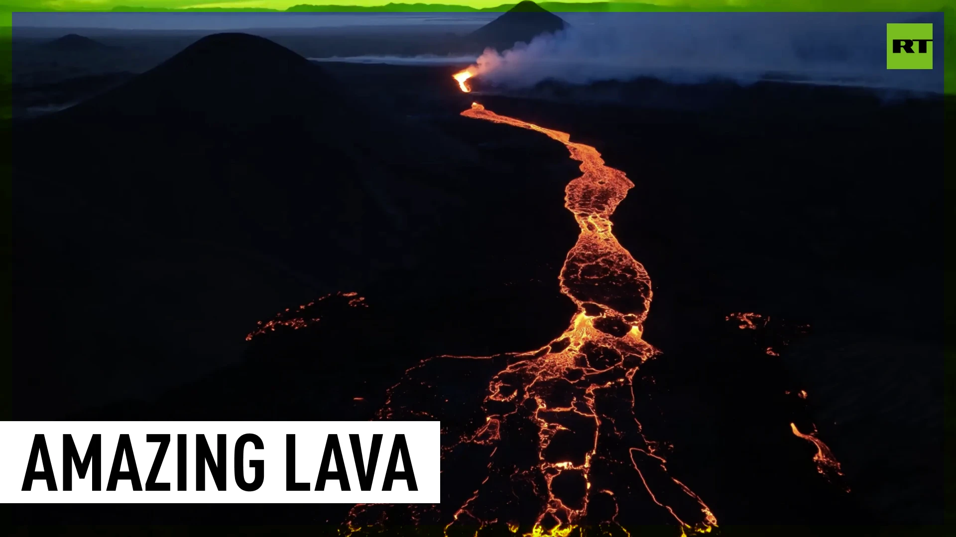 Lava rivers run down side of Icelandic volcano