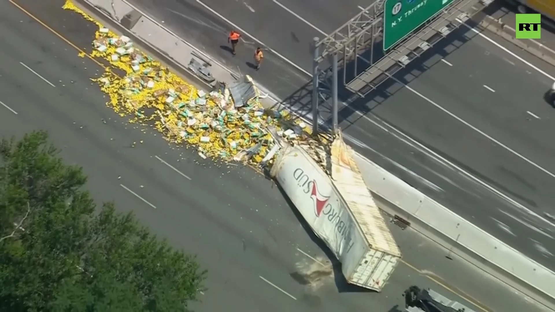 Tractor trailer overturns, spills hundreds of lemons on highway