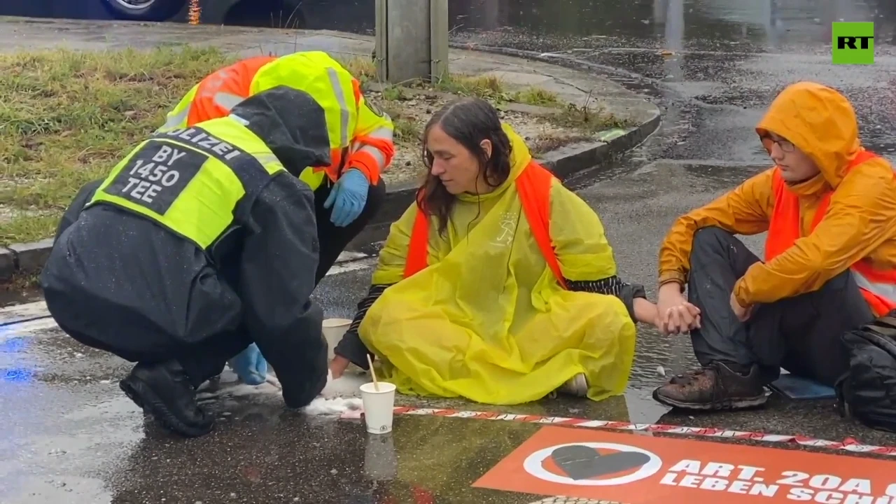 Activists glue themselves to roads in Germany, demanding climate action