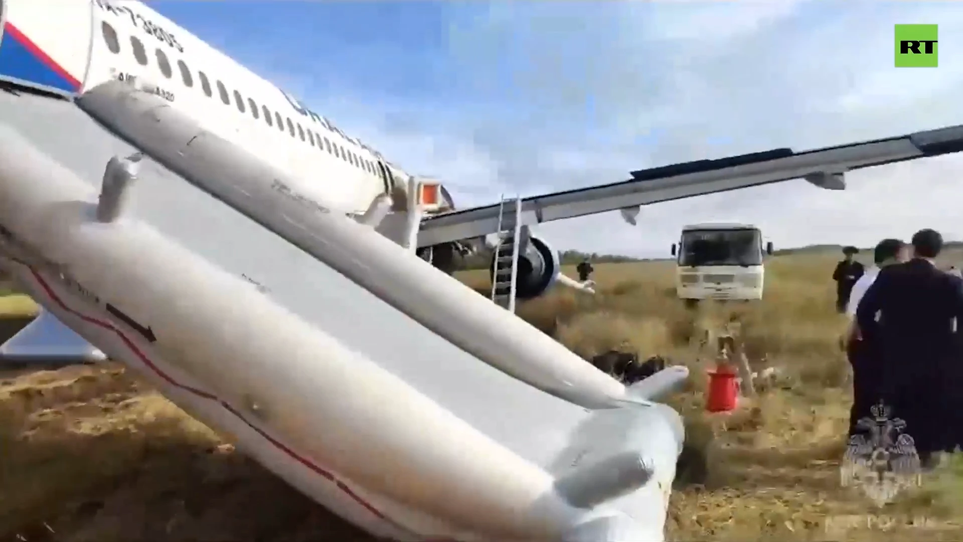 Russian passenger plane crash-lands in a field