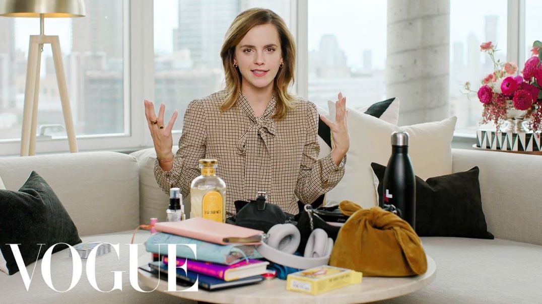 Inside Emma Watson's Prada Backpack - top up drunk, brainless slut.