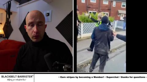 Police Officer Sprays members of a crowd with Pepper Spray