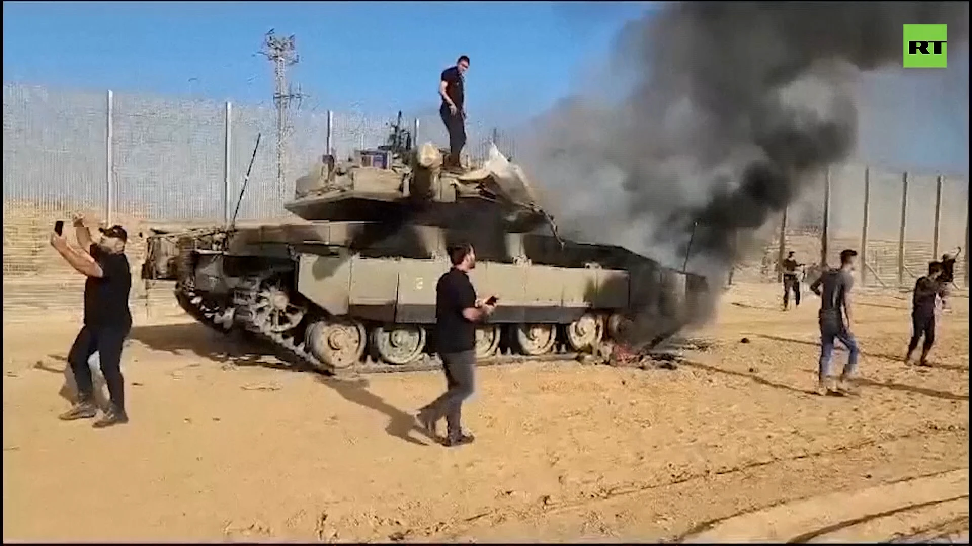 Israeli tank on fire as Palestinians cross border in the south of the country