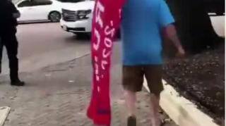 Guy spits on Trump flag - Instant Karma