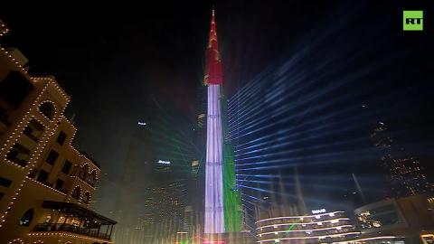 Iconic Dubai tower illuminated with Palestinian flag colors during New Year fireworks show