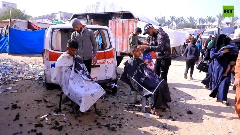 Damaged ambulance turned into barbershop in Gaza