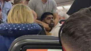 Currycel Tries to Molest Flight Attendant