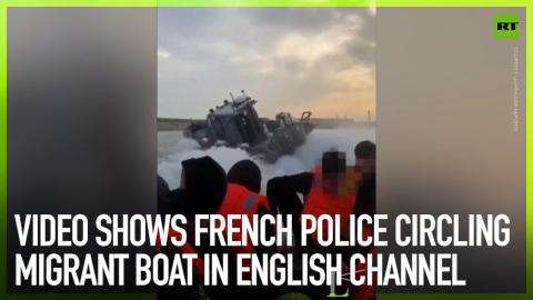 French police circling migrant boat in English Channel