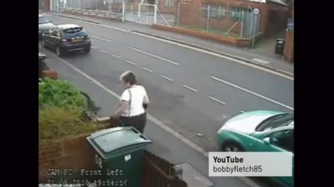 Woman throws cat into wheelie bin