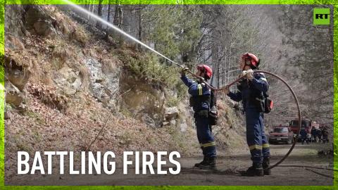 Firefighters battle flames in Greece's Pieria Mountains