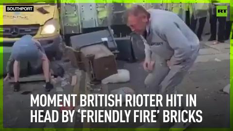 Moment British rioter hit in head by ‘friendly fire’ bricks