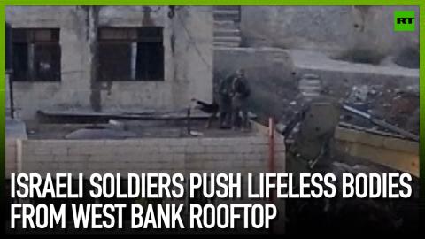 Israeli soldiers push lifeless bodies from West Bank rooftop