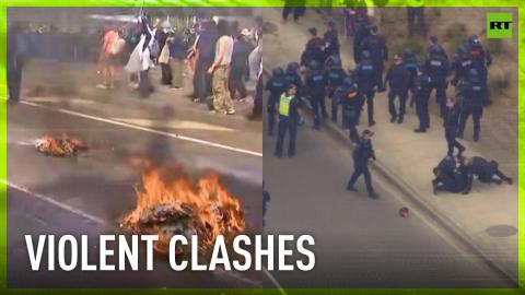 Anti-war protesters clash with police outside arms convention in Australia