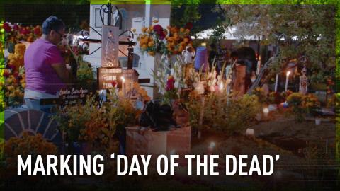 Locals flock to candle-lit cemetery to celebrate Day of the Dead in Mexico