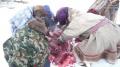 Reindeer Ritual - Raw meat shared by family of Nenet Herders