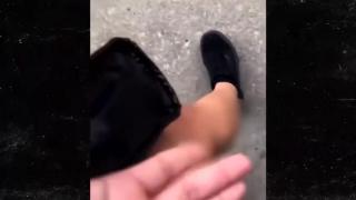 MAN NUTS & BUST ON WOMENS LEG AT STORE