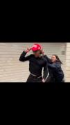 Lunatic Liberal Falls Flat on Her Face Trying To Take a Man's MAGA Hat