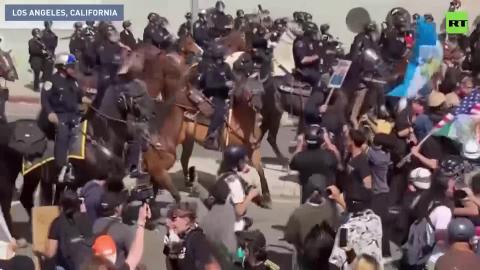 Some of the crowd are bracing for tear gas to be dispersed — Caleb Maupin