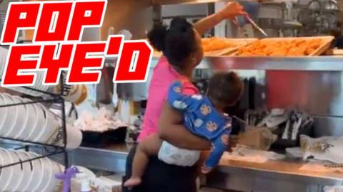 Woman Steals Chicken at Pop Eyes While Holding A Baby