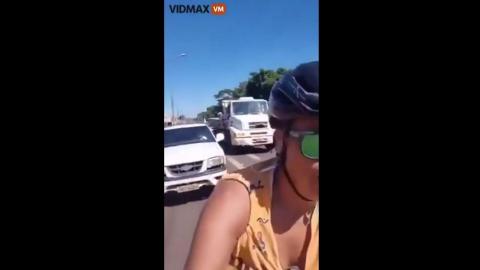 dumb fuck brain cell dead Asian rides a bike in the street