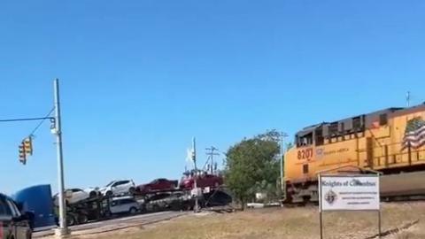 Train crashes into truck with cars on it - Stupid fucking Truck Driver.