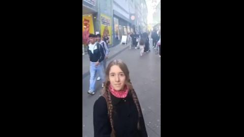 A German girl shows the destruction that has happened to her country by the globalist agenda