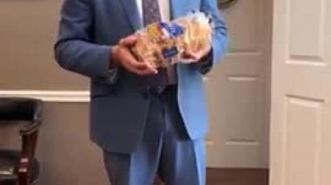 STATE SENATOR HOLDS UP 2 point 5-YEAR-OLD ALDI BREAD WITH ZERO MOLD