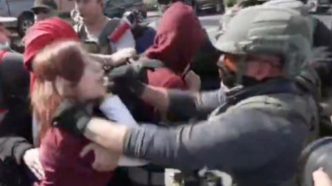 ICE Nightsticks a Lefty in the Throat