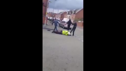FOR THIS YOU BETRAYED YOUR COUNTRYMEN - UK - GROUP OF MILITANT ALIEN INVADERS ATTACK POLICE OFFICER