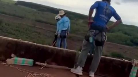 Woman attempts rope jump but instructors forget to attach the rope