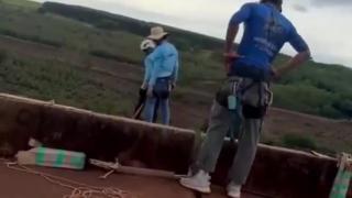 Woman attempts rope jump but instructors forget to attach the rope