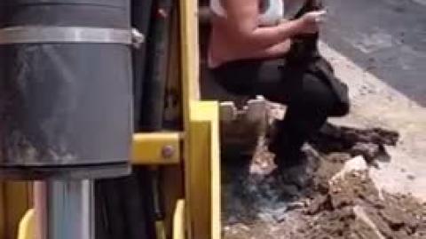 Excavator operator asked sheboon to get away from his machine = she refused